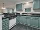 The kitchen features updated appliances, plenty of cabinetry, and generous countertop space at 5105 Carolwood Ln, Durham, NC 27713