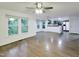 Living room with hardwood floors and view to the kitchen area at 5105 Carolwood Ln, Durham, NC 27713