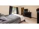 Inviting bedroom with large window, dresser, and comfortable bed for a restful retreat at 523 Edwards Rd, Henderson, NC 27537