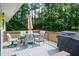 A beautiful deck with patio furniture, an umbrella, and a grill perfect for outdoor entertaining at 523 Edwards Rd, Henderson, NC 27537
