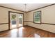 Dining room features hardwood floors, natural light, and access to an outdoor deck at 523 Edwards Rd, Henderson, NC 27537