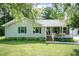 A cozy ranch home with a well-manicured lawn and lovely front porch is a must see! at 523 Edwards Rd, Henderson, NC 27537