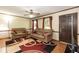 Cozy living room with hardwood floors, plush sofas, and plenty of natural light at 523 Edwards Rd, Henderson, NC 27537