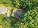 An aerial view of a secluded home surrounded by lush greenery at 5405 Swordsman Ct, Knightdale, NC 27545