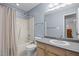Well-lit bathroom with a shower, tub, toilet, and vanity with a mirror at 5405 Swordsman Ct, Knightdale, NC 27545
