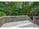 Outdoor deck offering a view of the backyard with abundant trees and foliage at 5405 Swordsman Ct, Knightdale, NC 27545