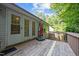 Spacious wooden deck with a closed umbrella, perfect for outdoor entertaining at 5405 Swordsman Ct, Knightdale, NC 27545