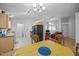 Bright kitchen and dining area with wood cabinets and view to the living room at 5405 Swordsman Ct, Knightdale, NC 27545