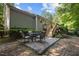 A patio with a table and chairs, perfect for outdoor dining and relaxation at 5405 Swordsman Ct, Knightdale, NC 27545