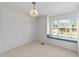 Bright bedroom with a window seat, beadboard accent wall, and stylish chandelier at 5545 Moneta Ln, Apex, NC 27539