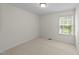 Cozy bedroom featuring neutral carpet and a sunny window at 5545 Moneta Ln, Apex, NC 27539