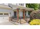 The front entrance features stone accents, a cozy porch, and well-maintained landscaping, adding to the curb appeal at 5545 Moneta Ln, Apex, NC 27539