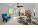 Living room with an open concept view, fireplace, ceiling fan and plenty of natural light at 5545 Moneta Ln, Apex, NC 27539