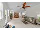 Open-concept living room and kitchen filled with natural light from the door and windows in the background at 5545 Moneta Ln, Apex, NC 27539
