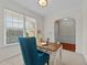 Bright and airy office space featuring a modern desk, a comfortable blue chair, and ample natural light at 5545 Moneta Ln, Apex, NC 27539