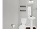 Simple half-bathroom with a pedestal sink and toilet at 567 E Ridge Ave, Liberty, NC 27298