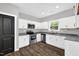 Modern kitchen with white cabinets, stainless steel appliances, and granite countertops at 567 E Ridge Ave, Liberty, NC 27298