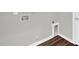 Laundry room with hardwood floors, grey walls, washing machine hookups and dryer vent at 567 E Ridge Ave, Liberty, NC 27298