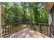Wooden back deck overlooking a private, wooded backyard, ideal for outdoor entertaining at 6009 Shadow Moss Cir, Raleigh, NC 27603