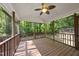 Spacious screened-in back porch with wooded views, perfect for outdoor relaxation and entertaining at 6009 Shadow Moss Cir, Raleigh, NC 27603