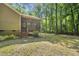 The house has a wooden staircase leading to a screened-in porch and an expansive backyard at 6009 Shadow Moss Cir, Raleigh, NC 27603