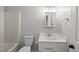 Clean, neutral bathroom with white fixtures, including vanity, toilet, and tub/shower combo at 6009 Shadow Moss Cir, Raleigh, NC 27603