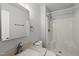 Neutral bathroom with updated vanity, mirror, lights, and a stand up shower at 6009 Shadow Moss Cir, Raleigh, NC 27603