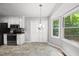 Bright dining area with large windows and stylish lighting at 6009 Shadow Moss Cir, Raleigh, NC 27603