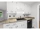 Kitchen with white cabinets and a black sink at 6009 Shadow Moss Cir, Raleigh, NC 27603