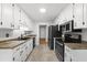 Efficient kitchen featuring ample cabinet space, modern appliances, and sleek countertops at 6009 Shadow Moss Cir, Raleigh, NC 27603