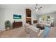 Cozy living room featuring a stone fireplace and comfortable seating, perfect for relaxation at 6009 Shadow Moss Cir, Raleigh, NC 27603