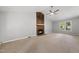Bright living room features a vaulted ceiling and a stone fireplace at 6009 Shadow Moss Cir, Raleigh, NC 27603