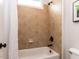 Bathroom with tiled shower/tub combo with white curtain at 612 Peach Orchard Pl, Cary, NC 27519