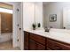 Bathroom featuring a vanity with a sink and access to a tiled shower/tub combo at 612 Peach Orchard Pl, Cary, NC 27519