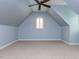 Carpeted bedroom with a vaulted ceiling and a window with shutters at 612 Peach Orchard Pl, Cary, NC 27519