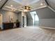 Spacious bonus room with wet bar, mini fridge, and unique ceiling with recessed lights at 612 Peach Orchard Pl, Cary, NC 27519