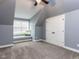 Light-filled bonus room featuring plush carpet, and a cozy window seat at 612 Peach Orchard Pl, Cary, NC 27519