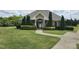 Attractive clubhouse with well-manicured lawn, lush landscaping, and easy access from sidewalk at 612 Peach Orchard Pl, Cary, NC 27519