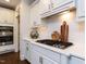 Stylish kitchen featuring white cabinetry, stainless steel appliances, and a gas cooktop at 612 Peach Orchard Pl, Cary, NC 27519