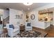 Open living room with hardwood floors and stairs leading to the bedrooms at 612 Peach Orchard Pl, Cary, NC 27519