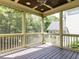 Relaxing screened-in porch with wood ceiling and views of mature trees at 612 Peach Orchard Pl, Cary, NC 27519