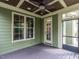 Screened in porch with wood ceiling and view to large backyard at 612 Peach Orchard Pl, Cary, NC 27519