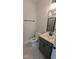 Contemporary bathroom with black fixtures, large mirror, and walk-in shower at 659 Bandon Aly, Cary, NC 27513
