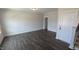 The living room offers plenty of space and natural light, with access to stairs and a door at 659 Bandon Aly, Cary, NC 27513