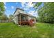 Expansive backyard featuring a large deck and screened-in porch, perfect for outdoor entertaining at 7 Teahouse Ct, Durham, NC 27707