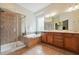 The primary bath includes a double vanity, soaking tub, and glass-enclosed shower at 7 Teahouse Ct, Durham, NC 27707