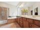The primary bath includes a double vanity, soaking tub, and glass-enclosed shower at 7 Teahouse Ct, Durham, NC 27707