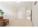 Bedroom featuring carpet, chair, closet, and view into hall at 7 Teahouse Ct, Durham, NC 27707