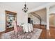Traditional dining room with hardwood floors, china cabinet, and staircase in the background at 7 Teahouse Ct, Durham, NC 27707