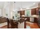 A kitchen boasting stainless steel appliances, granite countertops, and hardwood flooring at 7 Teahouse Ct, Durham, NC 27707